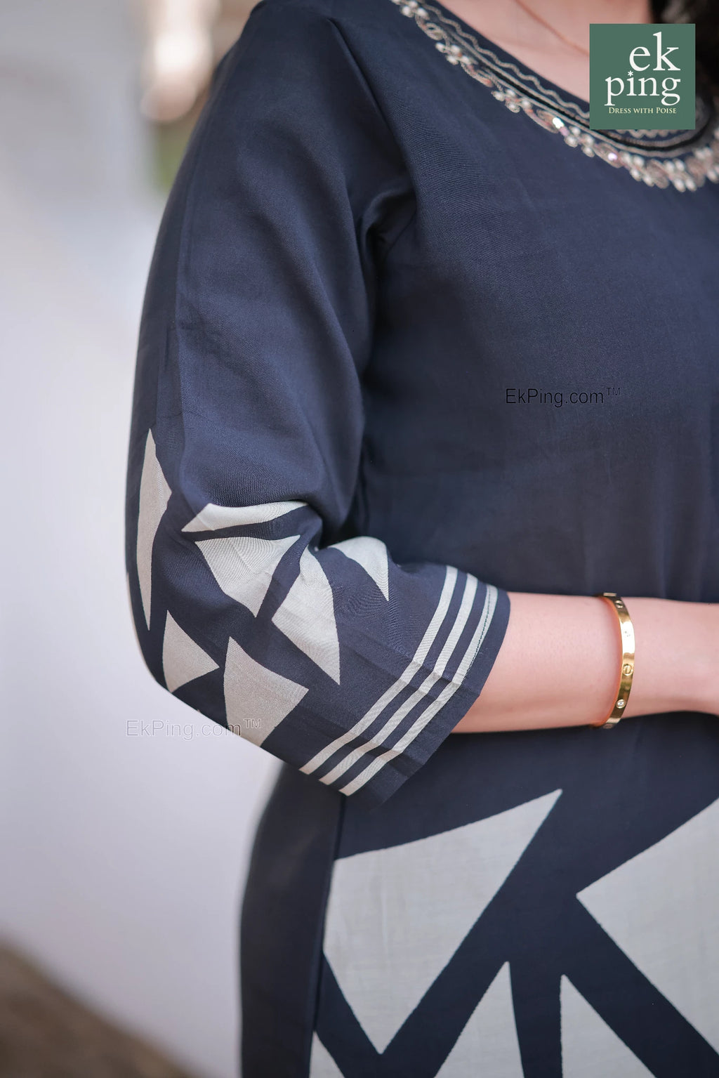 black daily wear long kurti and salwar set with geometric patterns on sleeves and a visible ekping brand logo.