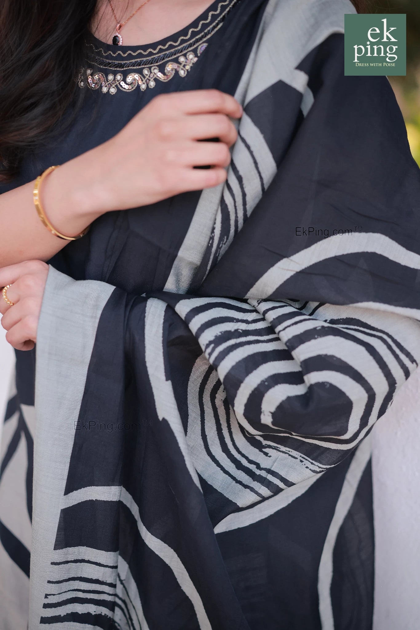 black daily wear long kurti and salwar set with ekping brand logo in the corner