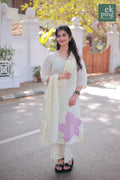 GIrl wearing Chanderi Off-White Salwar Set with matching Dupatta modelling on streets