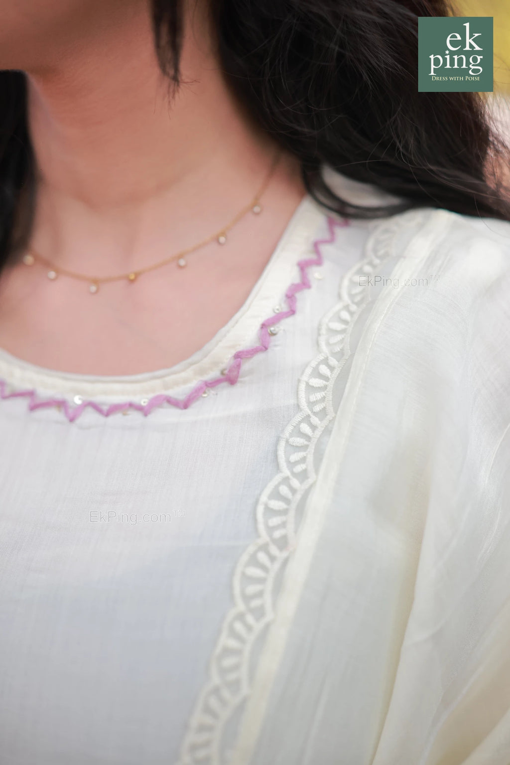 Close up view of the neck design of Chanderi Off-White daily wear Salwar top worn by a girl