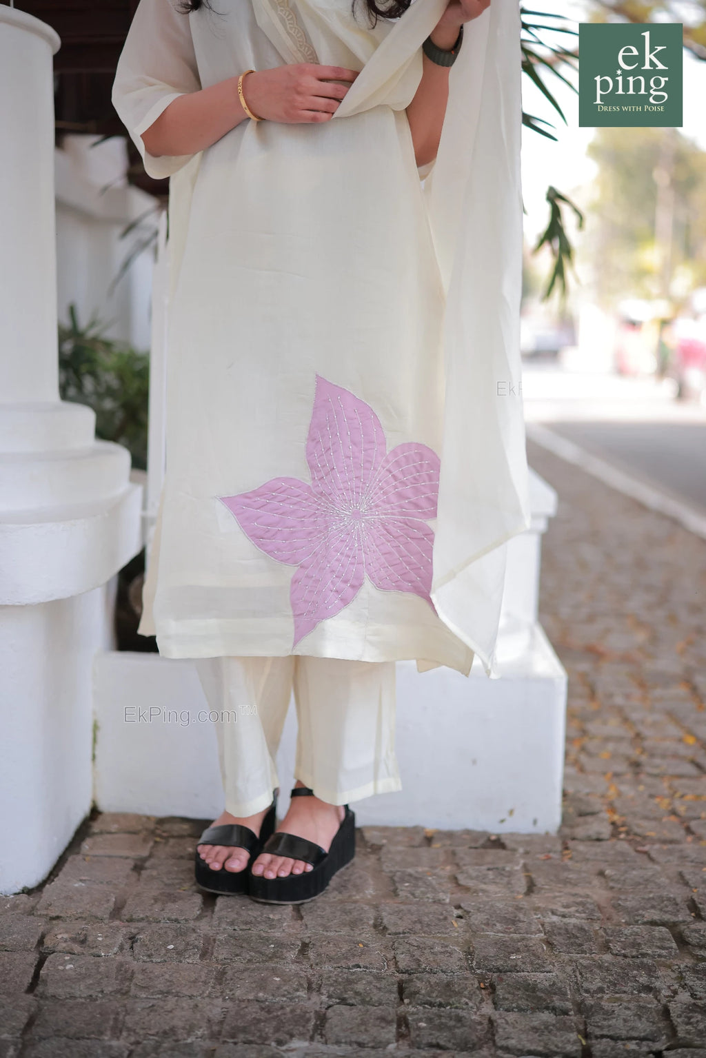 Close up view of the floral design on Chanderi Off-White daily wear Salwar top worn by a girl on street