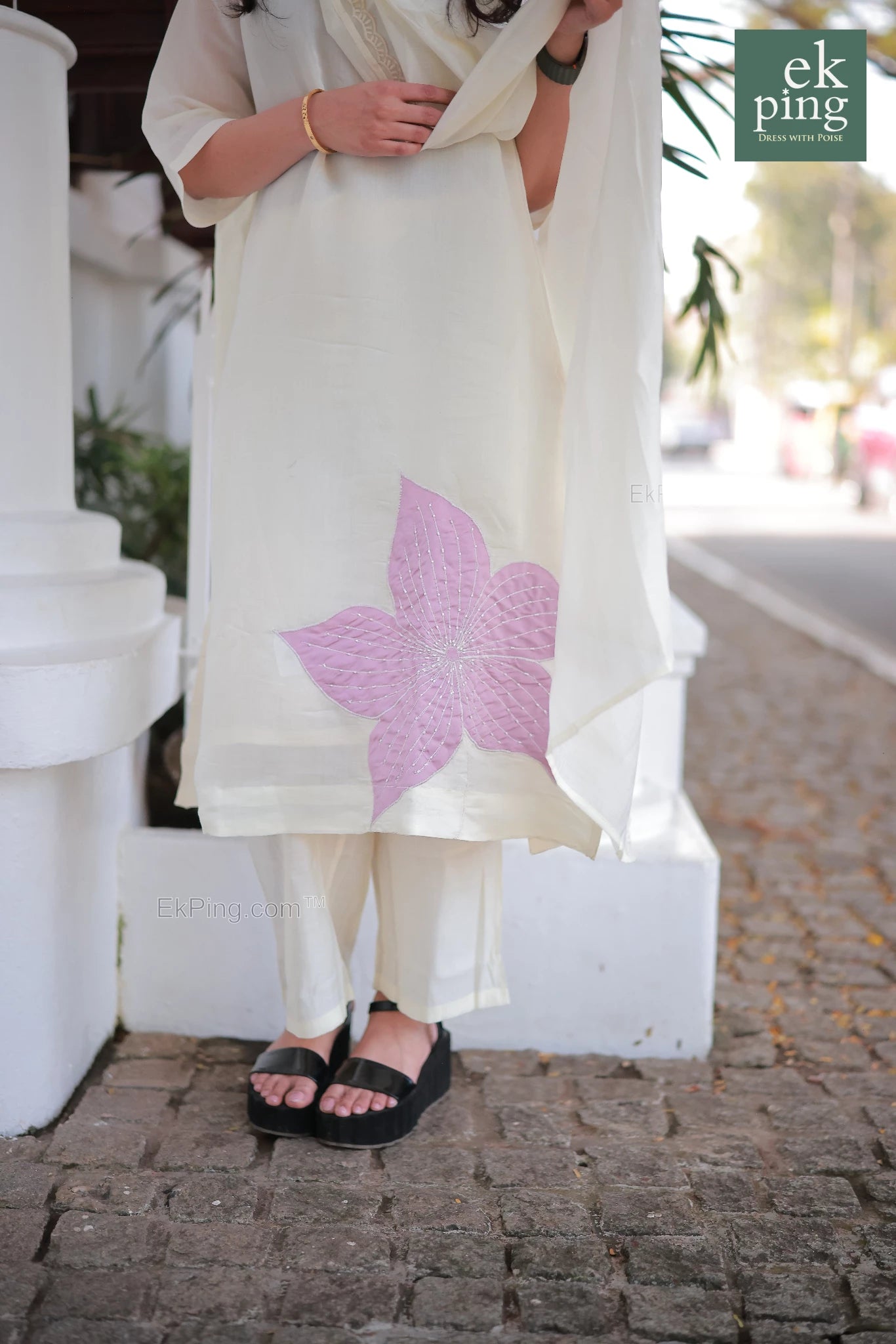 Close up view of the floral design on Chanderi Off-White daily wear Salwar top worn by a girl on street