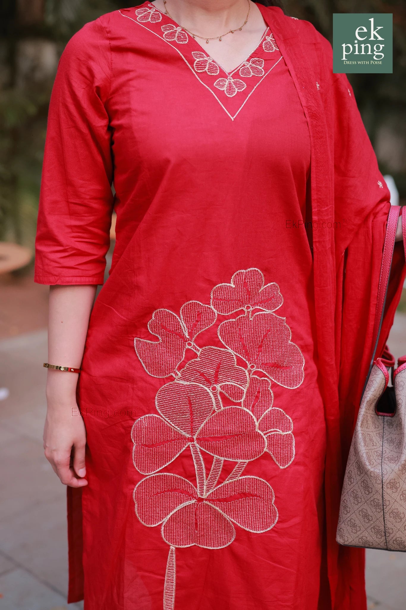 Red kurta with white floral embroidery worn by a girl, with 'ek ping' branding visible.