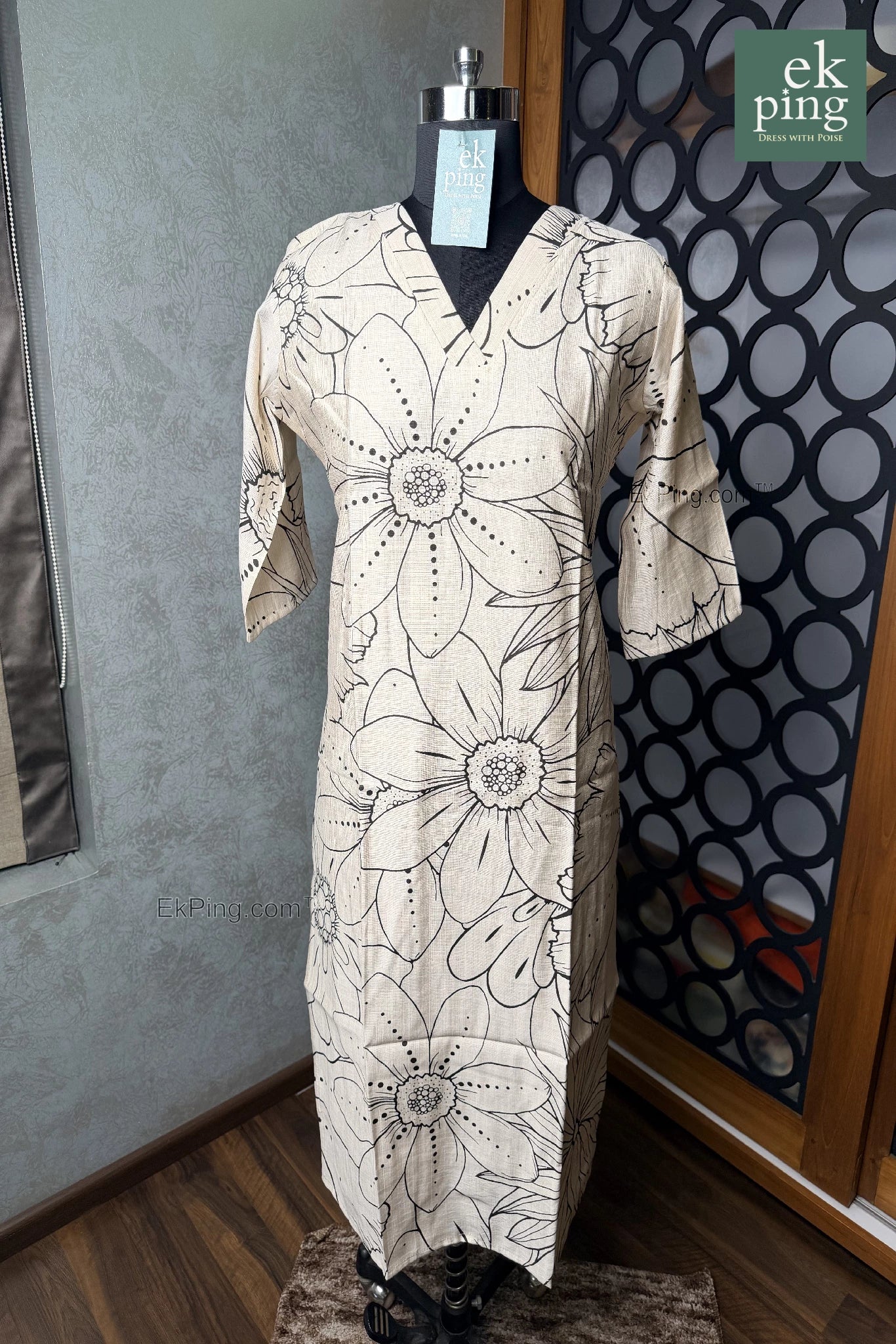 Cream floral office wear kurti on black manequin on wooden floor