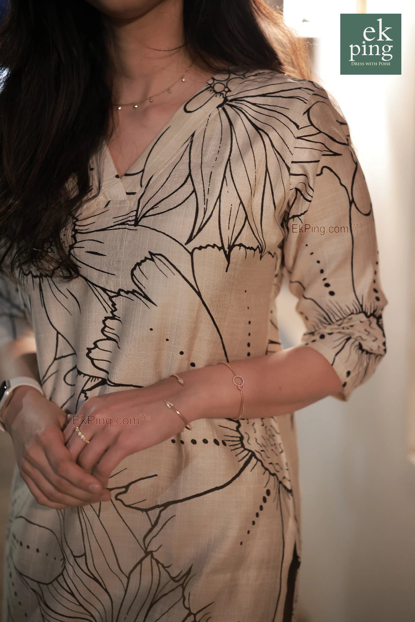 Girl in cream floral office wear kurti on street fort kochi with bracelet