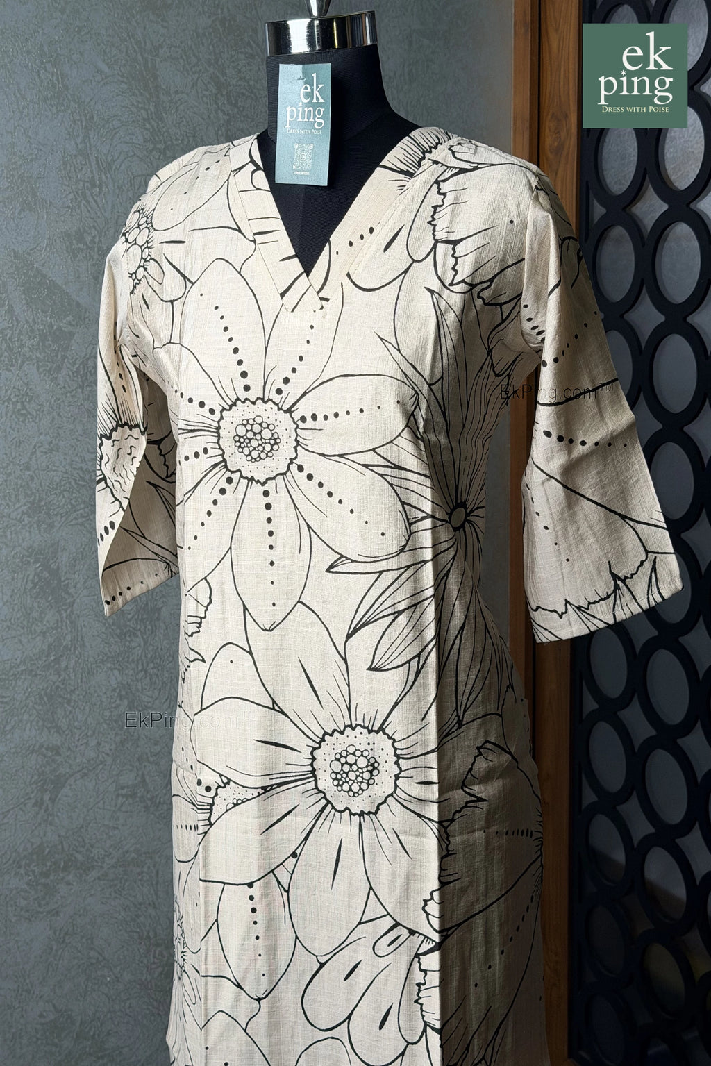 Cream floral office wear kurti on black mannequin