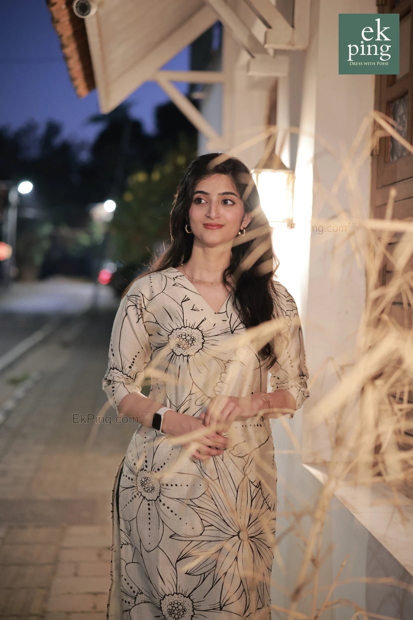 girl in cream floral office wear kurti top in street kochi modelling