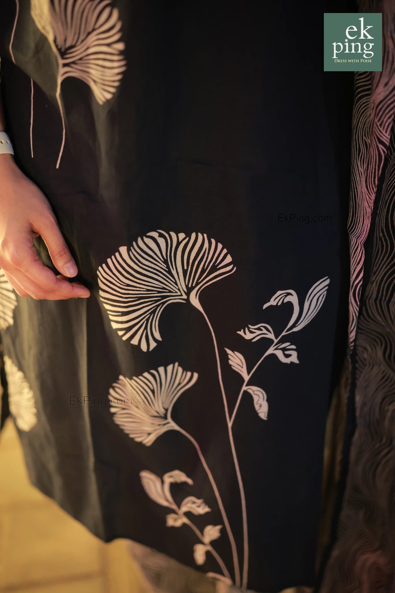 Close-up of a navy black salwar kurti , brand 'ek ping' visible.